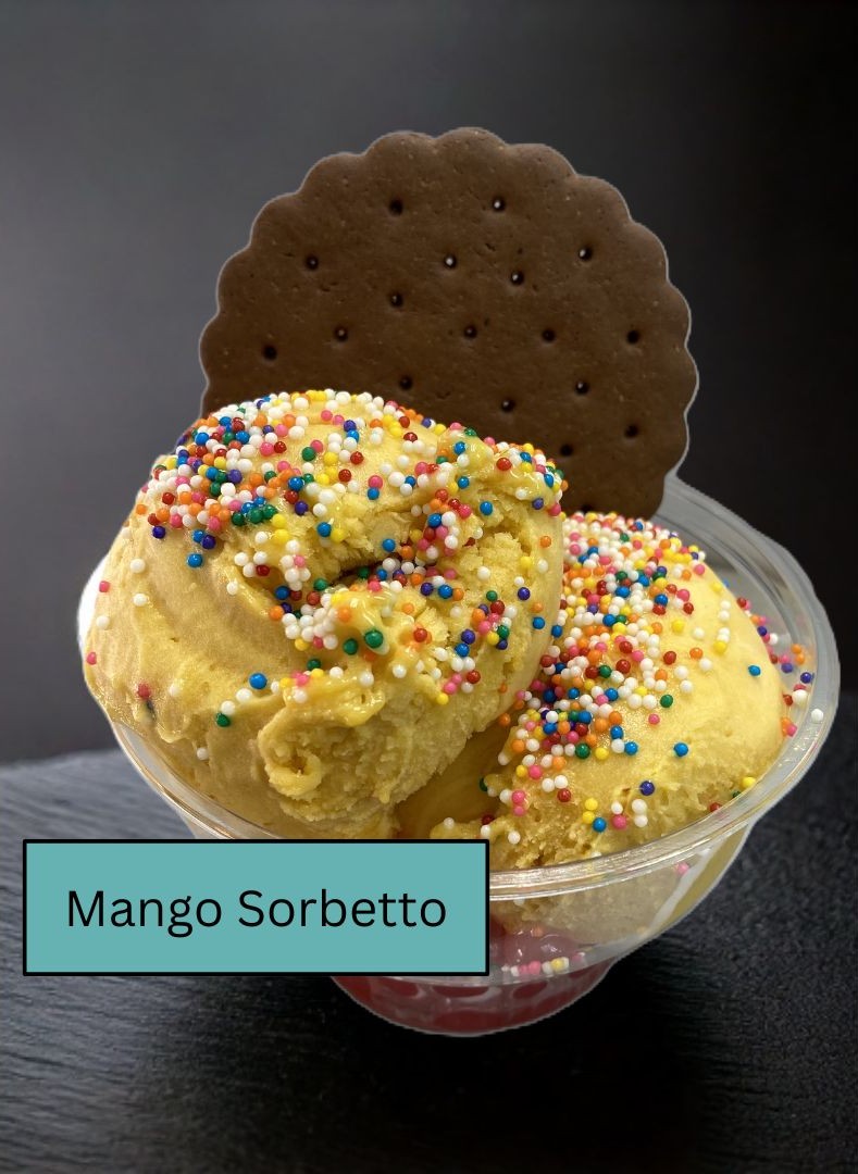 Mango Sorbetto with colorful sprinkles and chocolate wafer